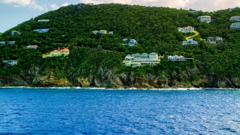 AX102_262.0000315F - Aerial stock photo of Hillside oceanfront mansions on a Caribbean island, Northside, St Thomas, the US Virgin Islands 