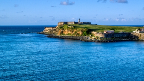 AX104_009.0000000F - Aerial stock photo of A view of Fort San Felipe del Morro, Old San Juan, Puerto Rico, sunset