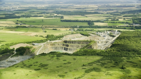 AX109_008.0000000F - Aerial stock photo of A quarry surrounded by farmland, Denny, Scotland