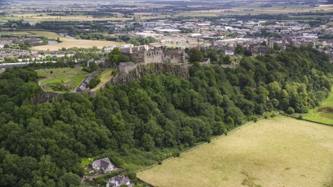 AX109_024.0000000F - Aerial stock photo of The historic Stirling Castle on a tree covered hill, Scotland