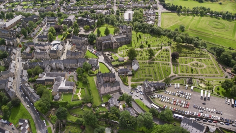 AX109_026.0000189F - Aerial stock photo of Church and cemetery by residential area, Stirling, Scotland