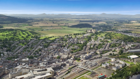 AX109_029.0000000F - Aerial stock photo of A view of historic Stirling Castle and residential area, Scotland