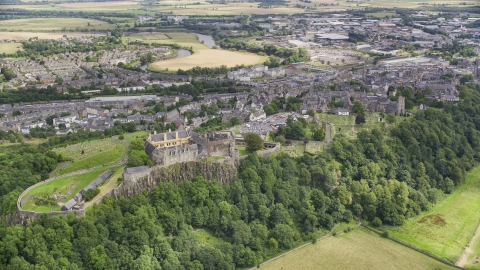 AX109_037.0000000F - Aerial stock photo of Stirling Castle on a tree covered hill, Scotland