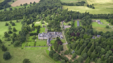 AX109_060.0000000F - Aerial stock photo of Keir House surrounded by trees, Scotland