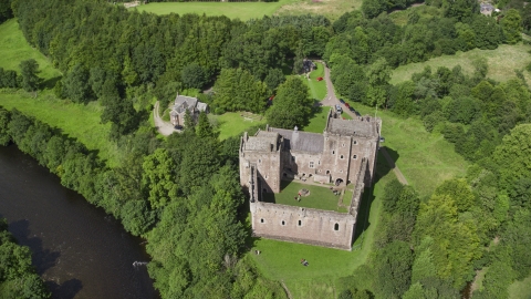 AX109_072.0000000F - Aerial stock photo of A view of historic Doune Castle and its grounds, Scotland