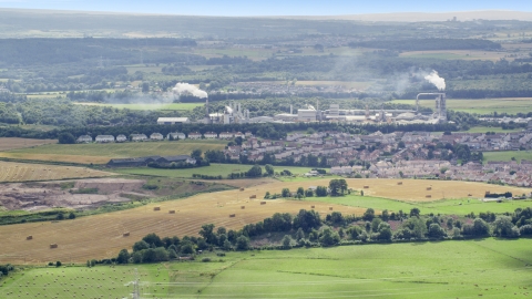 AX109_107.0000000F - Aerial stock photo of Factory and smoke stacks in a small town, Cowie, Scotland