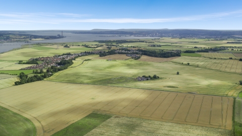 AX109_111.0000060F - Aerial stock photo of Farm fields around the village of Airth, Scotland