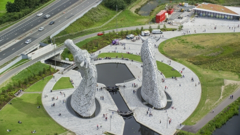 AX109_125.0000127F - Aerial stock photo of The back of the iconic Kelpies sculptures in Falkirk, Scotland