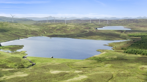 AX110_018.0000055F - Aerial stock photo of The Earlsburn Reservoirs and windmills, Scotland