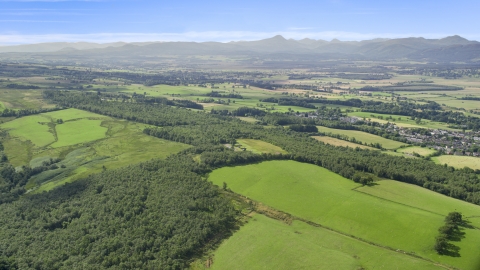 AX110_030.0000000F - Aerial stock photo of Forests and farm fields, Kippen, Scotland