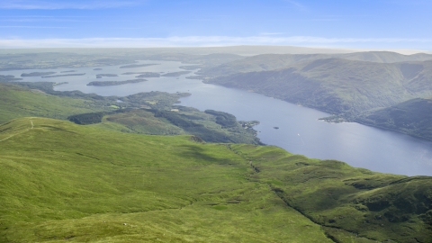 AX110_055.0000144F - Aerial stock photo of Loch Lomond lake seen from Ben Lomond in Scottish Highlands, Scotland