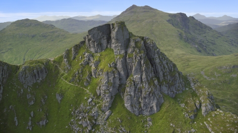 AX110_083.0000000F - Aerial stock photo of A jagged summit of The Cobbler mountain peak, Scottish Highlands, Scotland