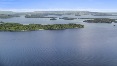 AX110_106.0000000F - Aerial stock photo of Tree-covered islands in Loch Lomond, Scottish Highlands, Scotland