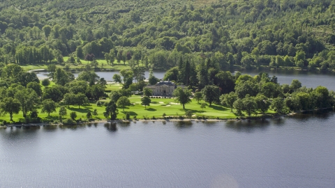 AX110_113.0000154F - Aerial stock photo of Rossdhu Mansion at Loch Lomond Golf Course, Luss, Scottish Highlands, Scotland