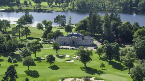AX110_114.0000229F - Aerial stock photo of Rossdhu Mansion at Loch Lomond Golf Course in Luss, Scottish Highlands, Scotland