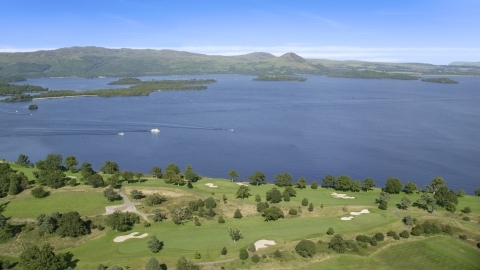 AX110_118.0000098F - Aerial stock photo of Waterfront Loch Lomond Golf Course in Luss, view of the lake, Scottish Highlands, Scotland