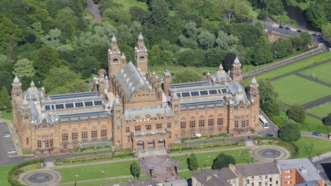 AX110_177.0000140F - Aerial stock photo of The Kelvingrove Art Gallery and Museum building in Glasgow, Scotland