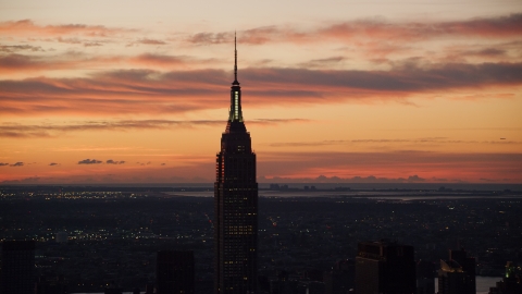 AX118_007.0000000F - Aerial stock photo of Empire State Building at sunrise in Midtown Manhattan, New York City