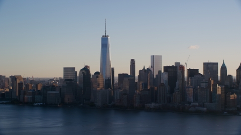 AX118_150.0000000F - Aerial stock photo of The Lower Manhattan skyline across the Hudson River at sunrise in New York City