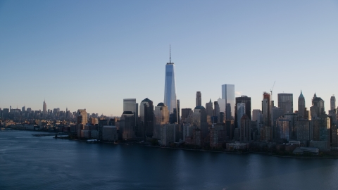 AX118_152.0000093F - Aerial stock photo of Freedom Tower and the World Trade Center skyline at sunrise in New York City