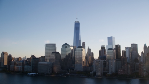 AX118_154.0000043F - Aerial stock photo of The World Trade Center skyline at sunrise in New York City
