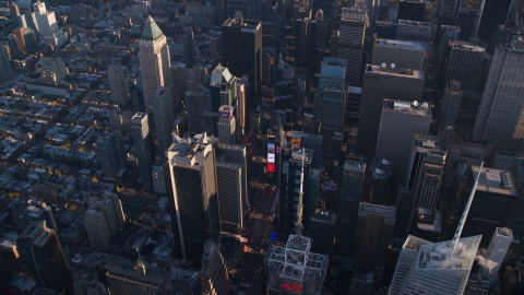 AX118_184.0000138F - Aerial stock photo of Times Square at sunrise in Midtown Manhattan, New York City