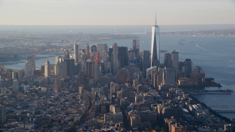 AX118_206.0000000F - Aerial stock photo of Freedom Tower and Lower Manhattan at sunrise in New York City