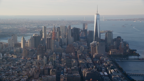 AX118_207.0000107F - Aerial stock photo of Lower Manhattan and One World Trade Center at sunrise in New York City