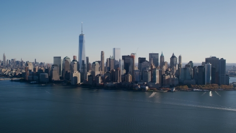 AX119_014.0000094F - Aerial stock photo of Skyline of Lower Manhattan across the Hudson River in New York City