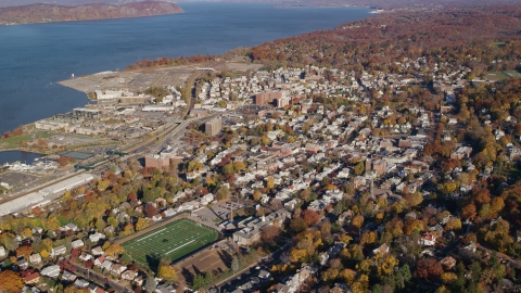 AX119_088.0000132F - Aerial stock photo of Riverfront towns of Tarrytown and Sleepy Hollow in Autumn, New York