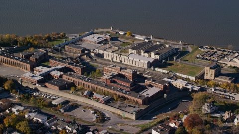 AX119_116.0000202F - Aerial stock photo of Sing Sing Correctional Facility in Autumn, Ossining, New York