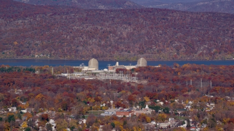 AX119_137.0000197F - Aerial stock photo of Indian Point Nuclear Power Plant in Autumn, Buchanan, New York