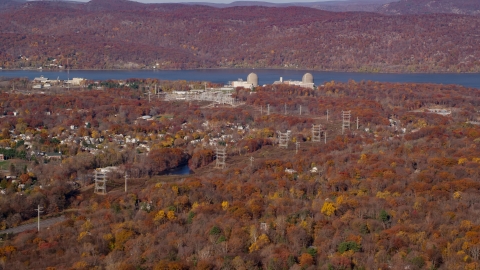 AX119_140.0000251F - Aerial stock photo of Indian Point Energy Center in Autumn, Buchanan, New York