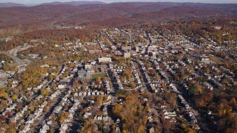 AX119_145.0000103F - Aerial stock photo of Small town residential neighborhoods in Autumn, Peekskill, New York