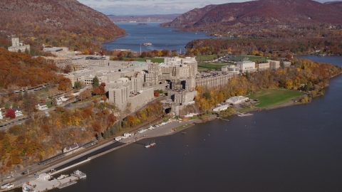 AX119_164.0000000F - Aerial stock photo of West Point Military Academy in Autumn, West Point, New York