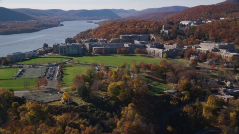 AX119_170.0000109F - Aerial stock photo of Campus of the West Point Military Academy in Autumn, West Point, New York