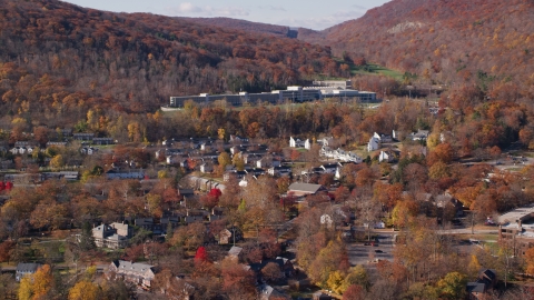 AX119_172.0000034F - Aerial stock photo of Housing at West Point Military Academy in Autumn, West Point, New York