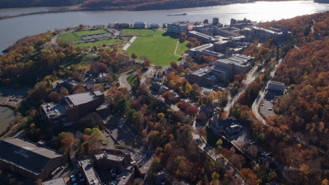 AX119_174.0000216F - Aerial stock photo of The United States Military Academy by the Hudson River in Autumn, West Point, New York