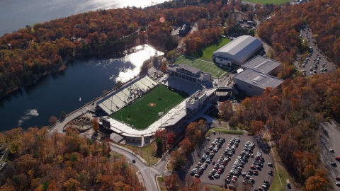 AX119_176.0000060F - Aerial stock photo of Michie Stadium at West Point Military Academy in Autumn, West Point, New York