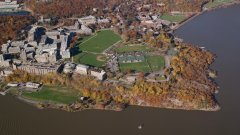 AX119_184.0000038F - Aerial stock photo of West Point Military Academy sports fields in Autumn, West Point, New York