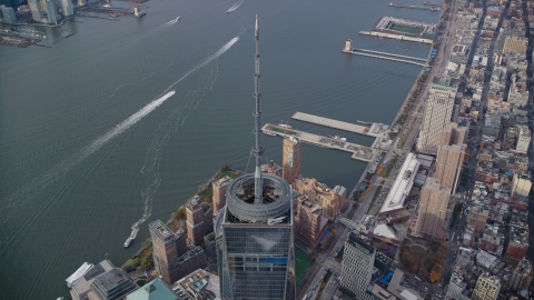 AX120_109.0000324F - Aerial stock photo of One World Trade Center spire and the Hudson River in Lower Manhattan, New York City
