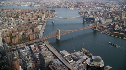 AX120_128.0000000F - Aerial stock photo of The Manhattan Bridge and the Brooklyn Bridge in New York City
