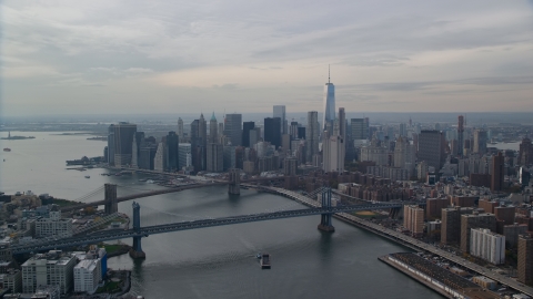 AX120_142.0000196F - Aerial stock photo of Lower Manhattan high-rises by the Brooklyn and Manhattan Bridges, New York City