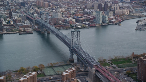 AX120_153.0000347F - Aerial stock photo of The Williamsburg Bridge spanning the East River in Autumn, New York City