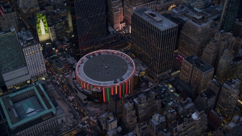 AX121_085.0000286F - Aerial stock photo of Madison Square Garden at sunset in Midtown, New York City