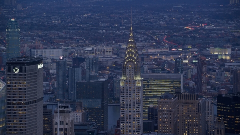 AX121_089.0000062F - Aerial stock photo of Top of Chrysler Building at sunset in Midtown, New York City