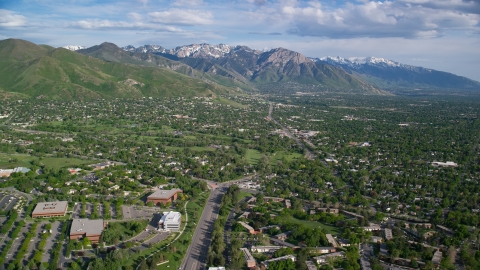AX129_079.0000295F - Aerial stock photo of Salt Lake City Suburbs, Wasatch Range, Salt Lake City, Utah