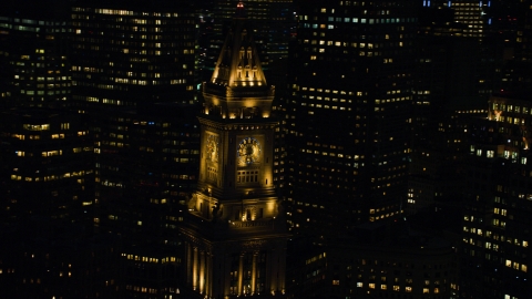 AX141_078.0000038 - Aerial stock photo of The top of Custom House Tower skyscraper in Downtown Boston, Massachusetts, night