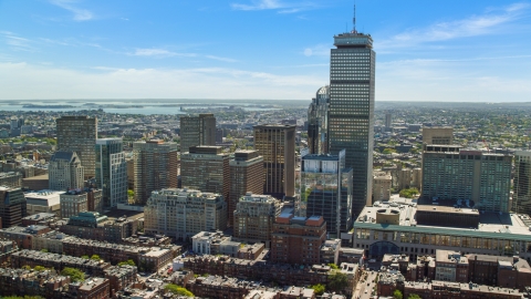 AX142_306.0000016 - Aerial stock photo of Prudential Tower skyscraper and city buildings, Downtown Boston, Massachusetts