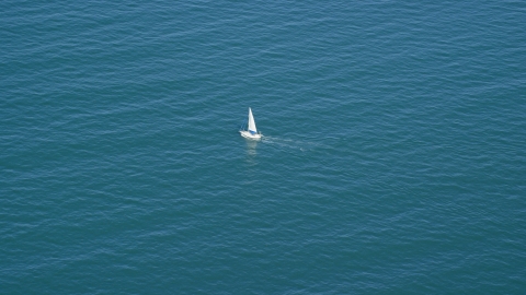 AX143_126.0000181 - Aerial stock photo of A boat sailing on Cape Cod Bay, Massachusetts